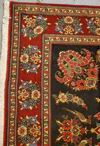 close up view Qom Handknotted rug  Top right corner border of the floral  carpet