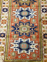 Load image into Gallery viewer, this is a closer look of the center terra cotta field and sage green guards of this 